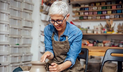 Woman smiling during pottery class